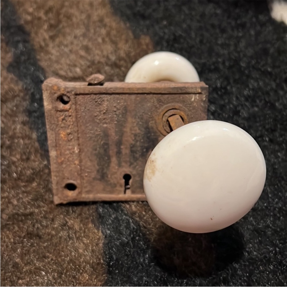 Antique cast iron and porcelain door knob with key hole